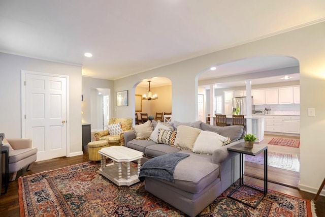 2195 Edison Ave NE, Atlanta, GA 30305 - living room with a notable chandelier, recessed lighting, baseboards, wood finished floors, and arched walkways