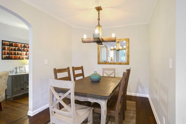 2195 Edison Ave NE, Atlanta, GA 30305 - dining space with wood finished floors, baseboards, arched walkways, and a notable chandelier