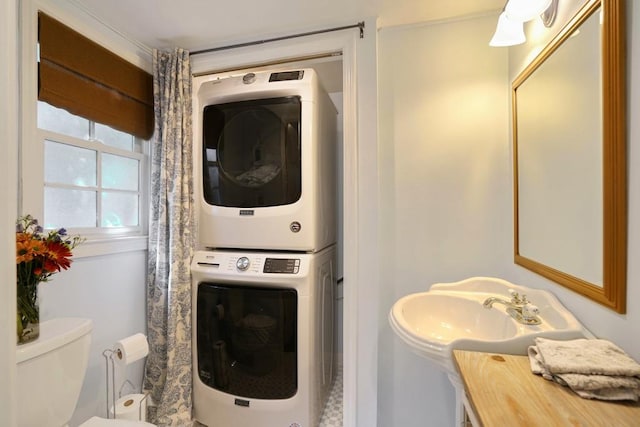 2195 Edison Ave NE, Atlanta, GA 30305 - bathroom featuring stacked washing maching and dryer and toilet