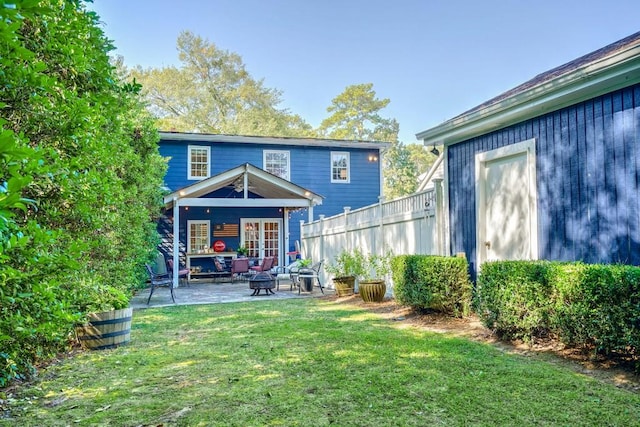 2195 Edison Ave NE, Atlanta, GA 30305 - back of property with a patio area, fence, a lawn, and an outdoor living space