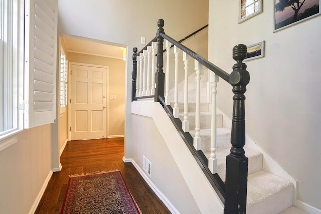 2195 Edison Ave NE, Atlanta, GA 30305 - stairs featuring visible vents, wood finished floors, and baseboards