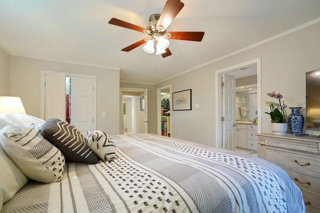 2195 Edison Ave NE, Atlanta, GA 30305 - bedroom featuring a closet, ensuite bathroom, ceiling fan, crown molding, and a walk in closet