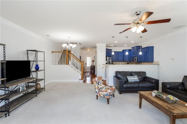 living room with light carpet, ornamental molding, stairs, and ceiling fan with notable chandelier