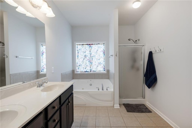 full bath with tile patterned flooring, a shower stall, a jetted tub, and a sink