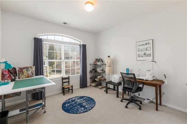 carpeted home office featuring visible vents and baseboards