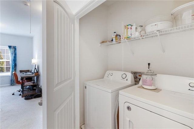 clothes washing area featuring washer and dryer, carpet, and laundry area