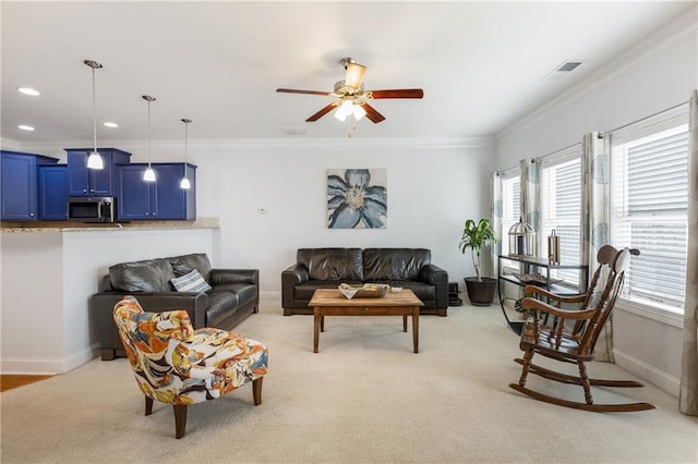 living room with visible vents, light colored carpet, crown molding, and baseboards