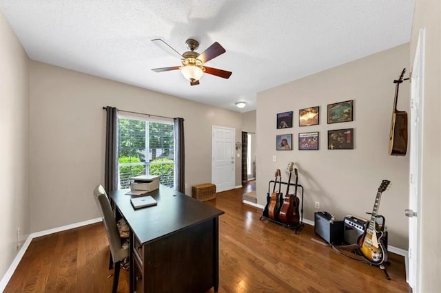 10535 Willow Meadow Cir, Alpharetta, GA 30022 - home office with a ceiling fan, dark wood-style flooring, and a textured ceiling