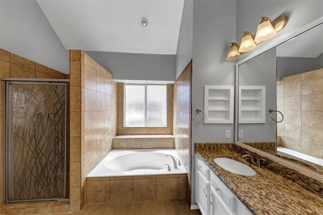 10535 Willow Meadow Cir, Alpharetta, GA 30022 - bathroom with lofted ceiling, vanity, a bath, and a stall shower