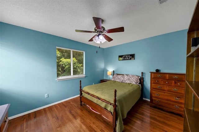 10535 Willow Meadow Cir, Alpharetta, GA 30022 - bedroom with wood finished floors, a textured ceiling, and a ceiling fan