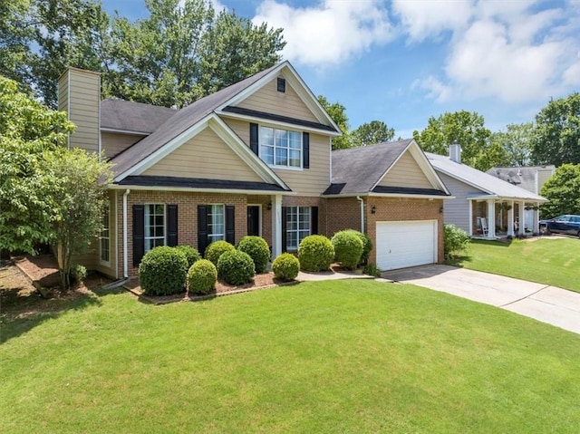 10535 Willow Meadow Cir, Alpharetta, GA 30022 - view of front of home with an attached garage, brick siding, a front yard, a chimney, and driveway
