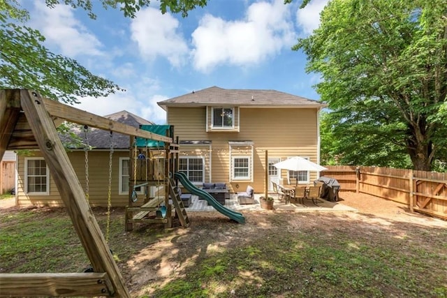 10535 Willow Meadow Cir, Alpharetta, GA 30022 - back of house featuring a fenced backyard, a playground, and a patio area