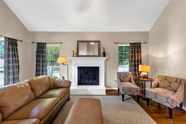 10535 Willow Meadow Cir, Alpharetta, GA 30022 - living room with lofted ceiling, wood finished floors, and a fireplace