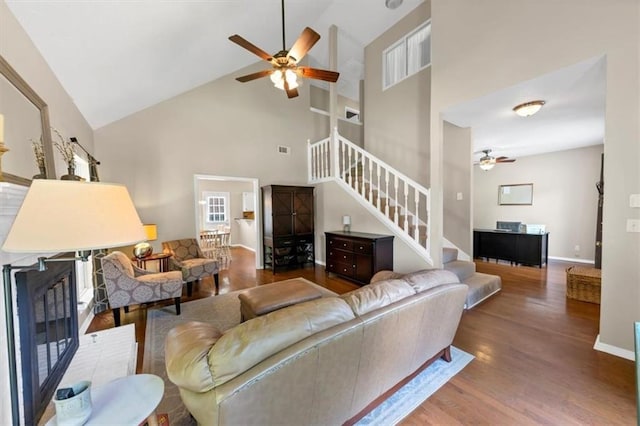 10535 Willow Meadow Cir, Alpharetta, GA 30022 - living area with ceiling fan, high vaulted ceiling, stairway, and wood finished floors