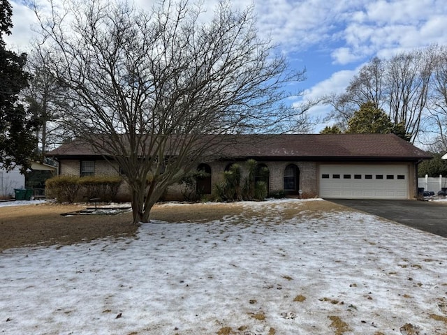 single story home featuring a garage