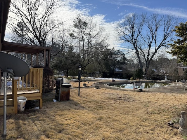 view of yard featuring a pool side deck