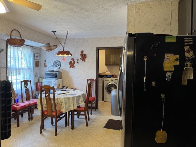 dining space featuring a textured ceiling, separate washer and dryer, and ceiling fan