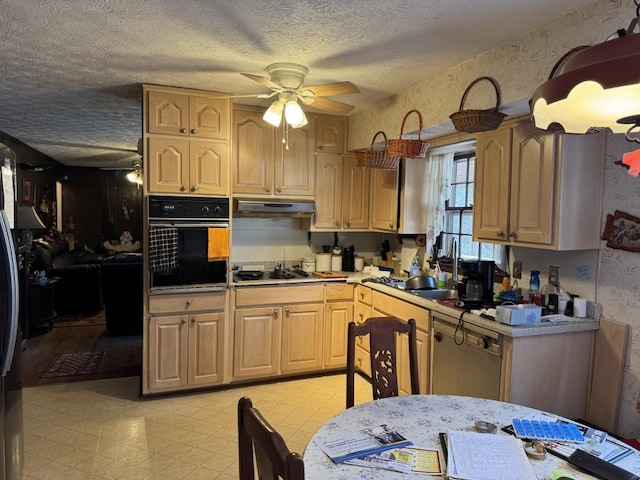 kitchen featuring black oven, light brown cabinets, sink, ceiling fan, and gas stovetop