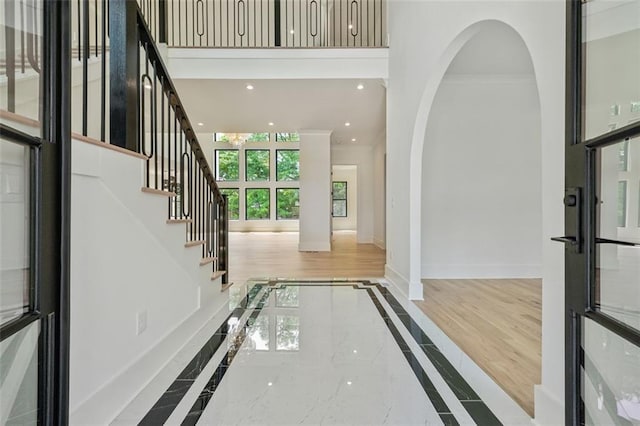 2797 Benson Dr, Marietta, GA 30062 - entryway featuring inlaid floor details, baseboards, recessed lighting, marble tiled floors, and stairway