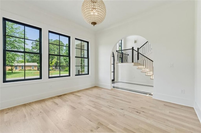 2797 Benson Dr, Marietta, GA 30062 - unfurnished room featuring a baseboard radiator, healthy amount of natural light, and a chandelier