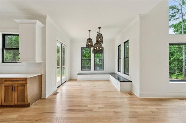 2797 Benson Dr, Marietta, GA 30062 - unfurnished dining area featuring light wood-style flooring, a chandelier, and baseboards