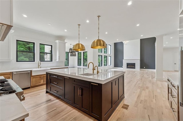 2797 Benson Dr, Marietta, GA 30062 - kitchen featuring dishwasher, a sink, light wood-type flooring, an island with sink, and recessed lighting