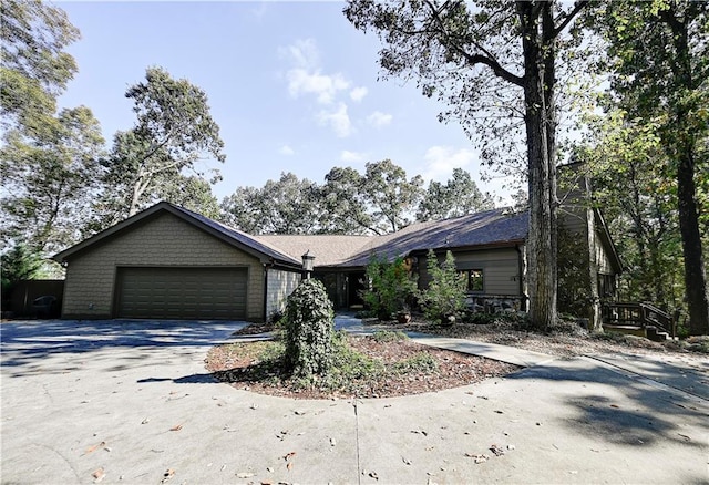 ranch-style house featuring a garage