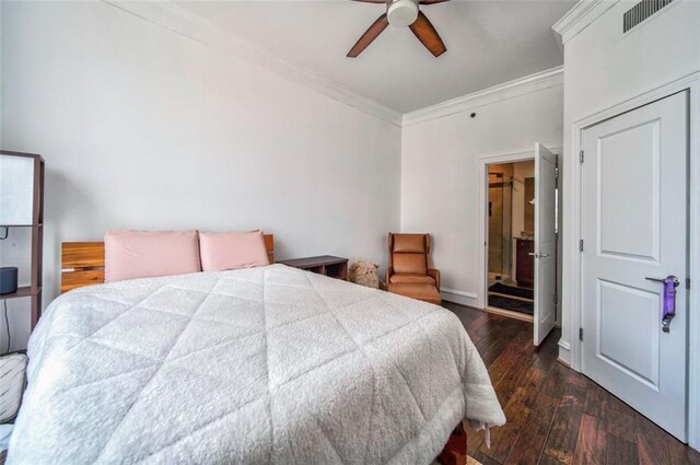 bedroom featuring dark wood-type flooring, crown molding, and ceiling fan