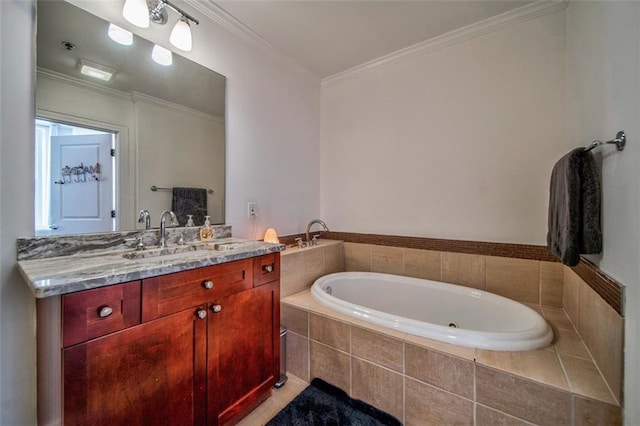 bathroom with a garden tub, crown molding, and vanity