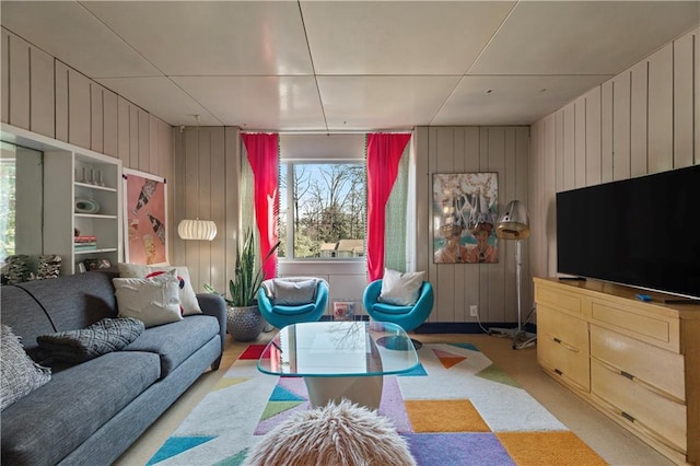 living room featuring wood walls