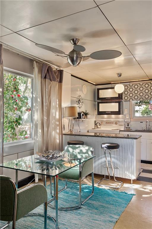 dining area with a ceiling fan