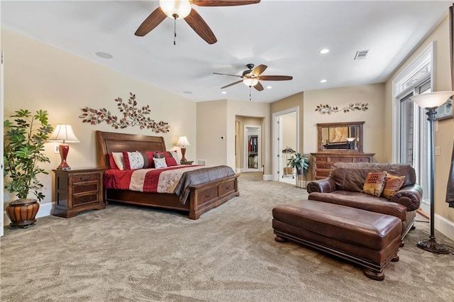 bedroom featuring ceiling fan and carpet