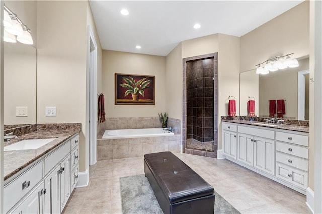 bathroom with vanity, tile patterned floors, and separate shower and tub