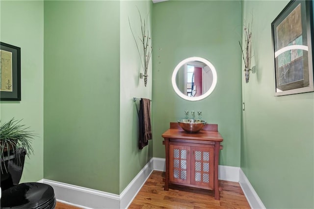 bathroom featuring hardwood / wood-style flooring and vanity