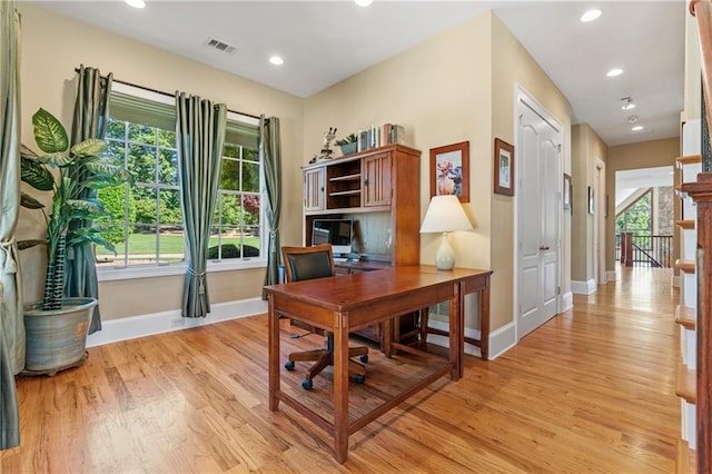 office space with light hardwood / wood-style flooring