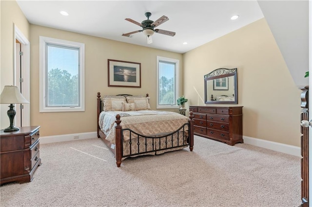 bedroom featuring light colored carpet and ceiling fan