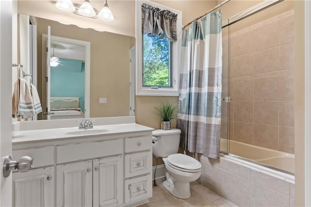 full bathroom featuring tile patterned floors, toilet, vanity, shower / bath combo with shower curtain, and ceiling fan