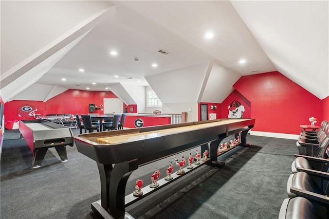 game room with lofted ceiling and dark colored carpet