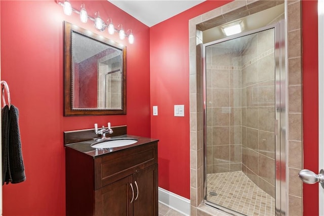 bathroom featuring vanity and an enclosed shower