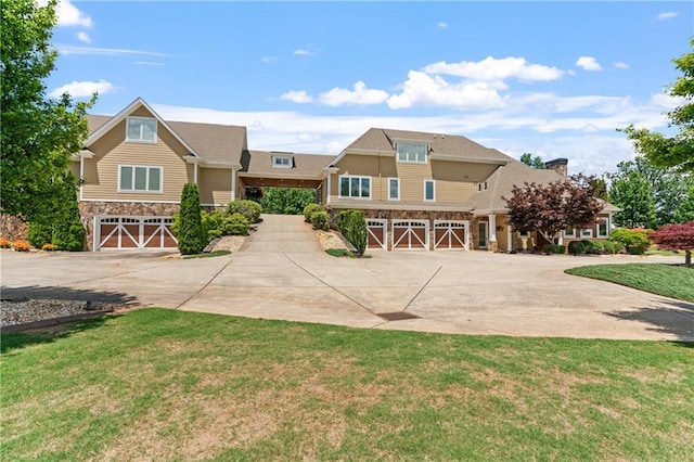 craftsman-style home featuring a garage and a front yard