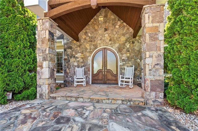 property entrance with french doors and covered porch