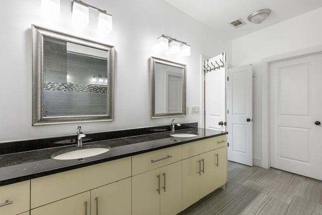 bathroom featuring vanity and hardwood / wood-style flooring