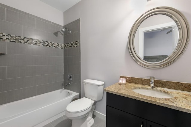 full bathroom featuring tile patterned floors, vanity, toilet, and tiled shower / bath