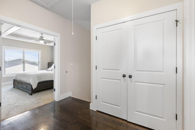 bedroom with dark hardwood / wood-style floors and ceiling fan