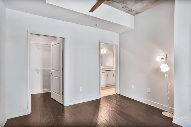 44 Peachtree Pl NE Unit 1929, Atlanta, GA 30309 - unfurnished bedroom with dark wood-style floors, a closet, and baseboards
