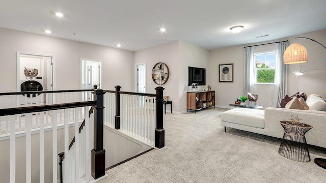 bedroom featuring baseboards, visible vents, light colored carpet, and recessed lighting