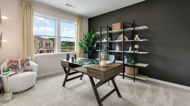office space featuring baseboards, visible vents, and carpet