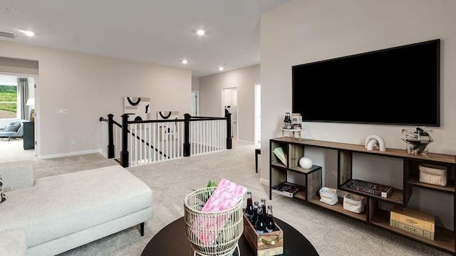 living room with recessed lighting, baseboards, and carpet floors