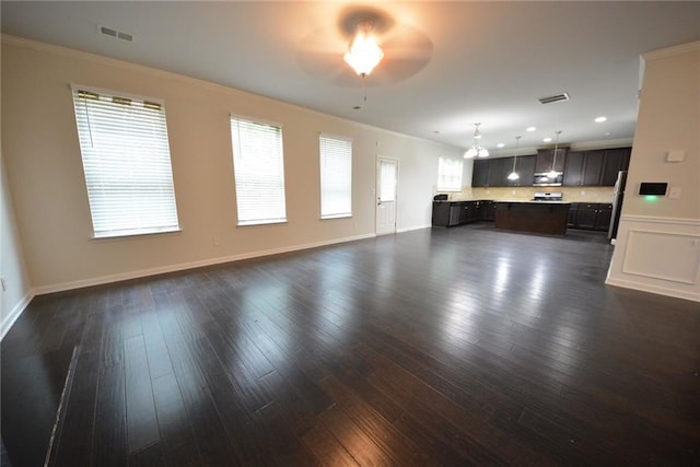 unfurnished living room with ceiling fan, crown molding, dark wood finished floors, recessed lighting, and baseboards