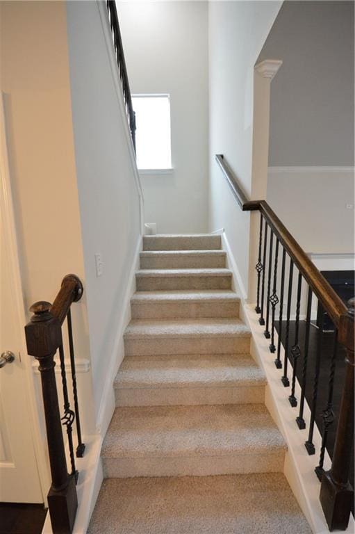 staircase with carpet flooring and baseboards